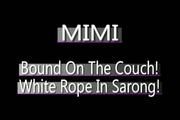 Video: Helpless asian girl is all roped up on the couch.