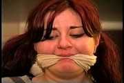 23 YR OLD REAL ESTATE BROKER IS WRAP BONDAGE TAPE GAGGED, MOUTH STUFFED, CLEAVE GAGGED, HANDGAGGED, BANDANNA GAGGED, GAGS ON A SPONGE, GAG-TALKING, NYLON COVERED BARE FEET AND TIED TO A CHAIR 