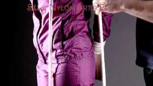 Mara tied and gagged with a cloth gag and ropes over her head wearing a supersexy purple shiny nylon rainsuit (Pics)