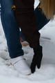 Linda with white clogs in the snow