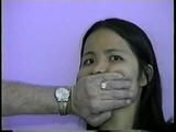 24 Yr OLD VIETNAMESE DAISY IS CLEAVE GAGGED, BAREFOOT, MOUTH STUFFED WITH NYLON ANKLE STOCKING, STUFFS HER OWN MOUTH, TIED ON BED & HANDGAGGED WITH BLACK LEATHER GLOVE (D55-5)