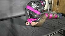 Marie M bound and gagged in shiny nylon Downwear trying to escape