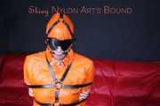 Sexy Pia being tied and gagged with belts a eye patch and a ballgag on a chair wearing a supersexy oldschool orange rainsuit (Pics)