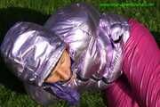 Watch Sandra beeing bound and gagged in her shiny nylon Downwear in the Garden