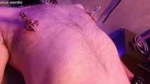 Mistress in apron needles nipples and sprays them on