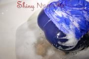 Watching Sonja taking a foam bath  wearing sexy blue shiny nylon rainwear (Pics)