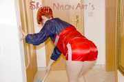 SONJA wearing a sexy red shiny nylon shorts and a red/blue rain jacket cleaning up the flat (Pics)