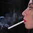 Black-haired Russian girl is smoking a 100mm cigarette in this fetish close up video