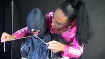 Sexy Ajyana being tied, gagged, hooded and dominated by Stella wearing sexy shiny nylon rainwear on a hairdresser´s chair Part 1 of 2 (Video)