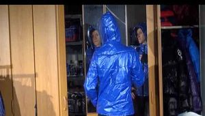 Sonja wearing a sexy black shiny skinny pant and a shiny blue down jacket trying on several shorts (Video)