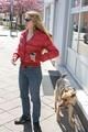 Katharina wearing a shiny nylon down jacket and a jeans while taking her dog out (Pics)