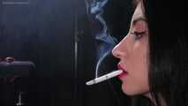 Black-haired Russian girl is smoking a 100mm cigarette in this fetish close up video