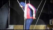 Sonja hanging tied, gagged and hooded with ropes on the ceiling wearing a supersexy oldschool down suit (Video)