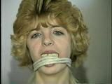 18 YEAR OLD CUTIE FACE TERRI IS MOUTH STUFFED, CLEAVE GAGGED, ROPE GAGGED, CROTCH ROPED, TIED UP WEARING LINGERIE AND BAREFOOT (D56-6)