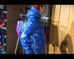 Sonja wearing a sexy black shiny skinny pant and a shiny blue down jacket trying on several shorts (Video)