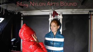 SEXY RONJA wearing shiny nylon downwear being tied and hooded with tapes from Stella on a rack (Pics)