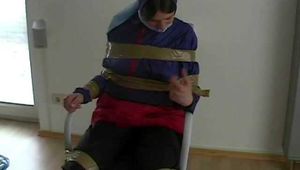 5 short Videos with Katharina tied and gagged in shiny nylon rainwear from 2005-2008