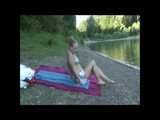 2 Videos of a nice woman having fun at the beach enjoying her Shiny Nylon SHorts from or 2010 Archive