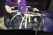 Watching sexy Sonja being tied and gagged from another woman both wearing shiny nylon rainwear (Pics)