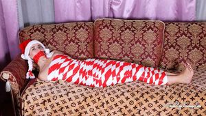 Bekki - Mummified for Christmas in red and white tape
