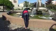 Watching sexy Sonja wearing sexy shiny nylon rainwear walking around the pedestrian area (Video)