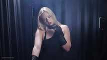 Blonde is smoking in a black leather gloves