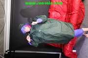 Pia wearing several layers of shiny nylon rainwear (Oics)