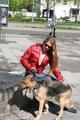 Katharina wearing a shiny nylon down jacket and a jeans while taking her dog out (Pics)