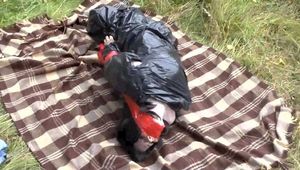 [From archive] Stella is captured and strictly hogtaped in trash bag dress (video)