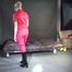 ***NEW MODELL MIA*** wearing a sexy red shiny nylon catsuit and black shiny rubber boots with heels during preparing her bed (Video)