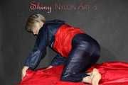 Watching Sonja wearing a black shiny nylon rain pants and a shiny nylon rain jacket preparing bed (Pics)