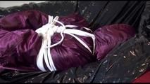 Lucy tied, gagged and hooded on the sofa wearing a sexy purple shiny nylon downwear combination (Video)