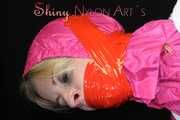 Watching sexy Pia being tied and gagged with ropes and a clothgag on a hairdressers chair wearing a very sexy pink rainwear combination with hood (Pics)