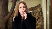 Anastasia is smoking  120mm cigarette outside