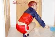 SONJA wearing a sexy red shiny nylon shorts and a red/blue rain jacket cleaning up the flat (Pics)