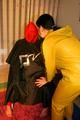 Jill tied, gagged and double hooded on a chair by an archive girl both wearing shiny rainwear (Pics)