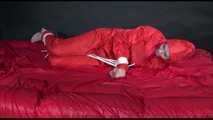 *** HOT HOT HOT*** NEW MODELL*** DESTINY wearing a new sexy red shiny nylon rain suit tied and gagged on bed with ropes and a cloth gag (Video)