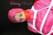 Watching sexy Pia being tied and gagged with ropes and a clothgag on a hairdressers chair wearing a very sexy pink rainwear combination with hood (Pics)