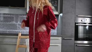 Miss Alice in Nylon rainsuit covered with transparent raingear