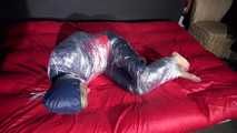 Sexy Sonja wearing an oldschool rainwear suit being tied and gagged with plastic wrap (Video)