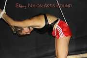 Sexy Sandra being tied and gagged overhead wearing a sexy red shiny nylon shorts and a black swimsuit (Pics)