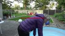 Watching sexy Sonja wearing a sexy shiny nylon rain pant and a purple down jacket enjoying the water in the swimming pool (Video)