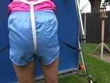 Watch Sandra enjoying Bondage in her shiny nylon Shorts in the Garden Pantyhooded finally