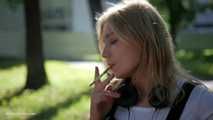 Sweet Polina is smoking 120mm cork cigarettes in the park