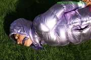 Watch Sandra beeing bound and gagged in her shiny nylon Downwear in the Garden