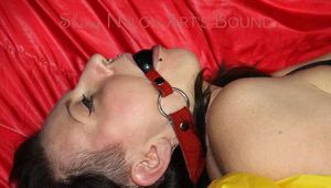 SEXY MARA ties and gagges herself with cuffs and a ball gag wearing a sexy red/yellow shiny nylon shorts and a sexy yellow top (Pics)