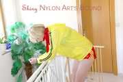 SEXY PIA being tied and gagged on a stairway with cuffs and a cloth gag wearing a sexy red shiny nylon shorts and a yellow rain jacket (Pics)