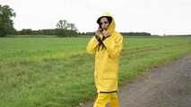 Miss Amira on the road in a Frisian mink, yellow rain dungarees and rubber boots