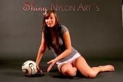 Alina wearing sexy white shiny nylon shorts and a grey top while posing with a soccer ball (Pics)