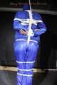 Watching sexy Pia being tied and gagged overhead with ropes and a ballgag wearing a supersexy blue shiny nylon bib overall and a rain jacket (Pics)